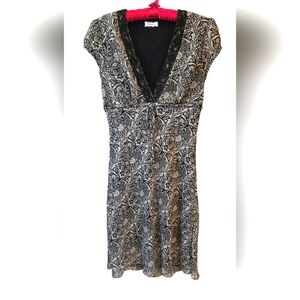 Women's grey/black short sleeved dress with empire waist. Size 6.